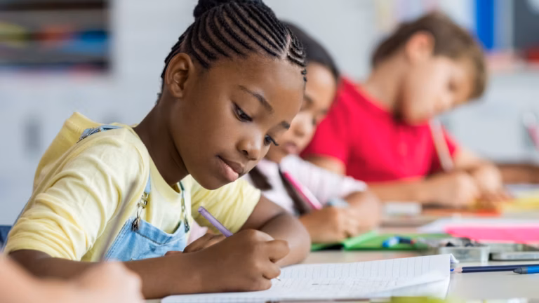 Students in a row, working in class