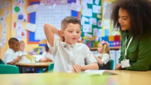 kid in school with teacher