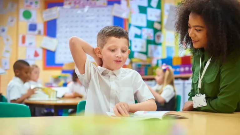 kid in school with teacher