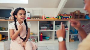 Kid practicing with teacher_