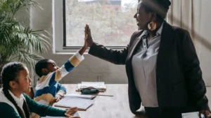 Teacher and student high five