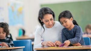 Teacher helping a student with their work