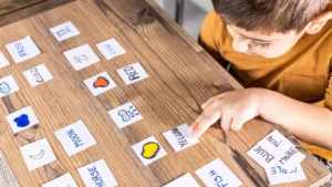 Child matches words with pictures during a literacy activity