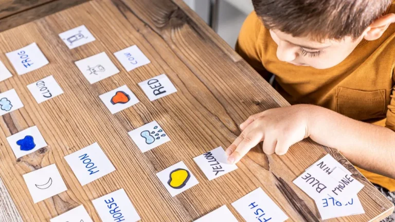 Child matches words with pictures during a literacy activity